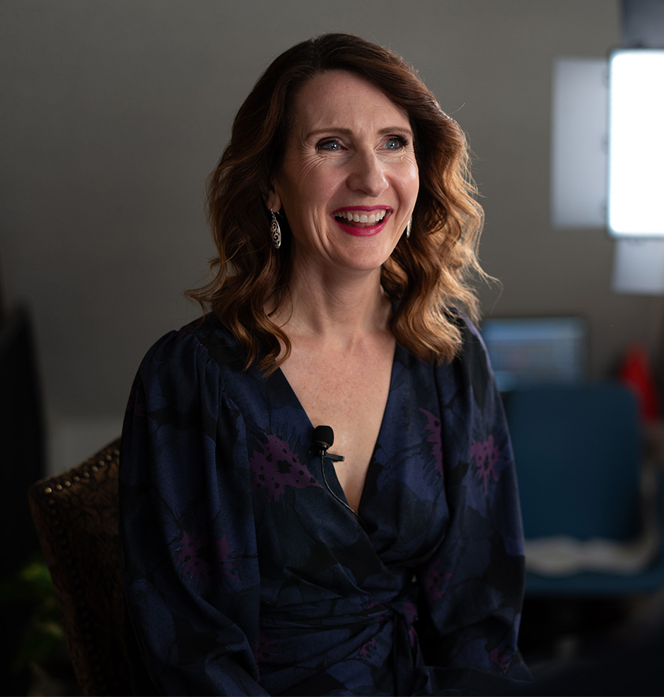 Rachael-Jayne smiling, eyes off camera