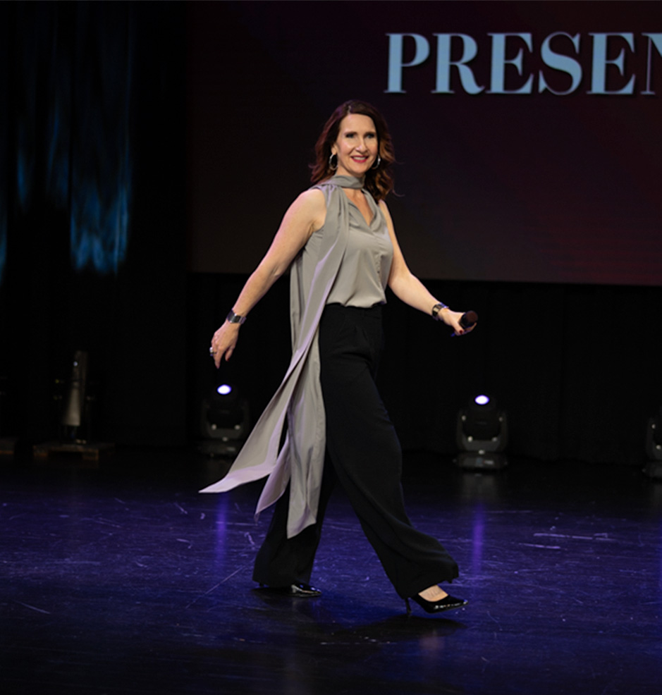 Rachael-Jayne walking across the stage